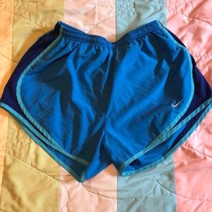 Blue Nike running shorts